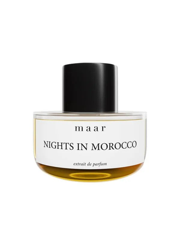 nights in morocco perfume bottle in dramatic desert light, a bold unisex scent of oud and spice