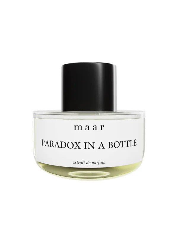 bold paradox in a bottle perfume bottle with dramatic side-lighting on sleek design