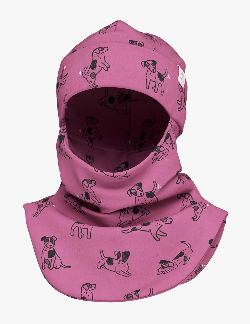 a child giggling in a pink dogs balaclava during a sunny autumn playground adventure