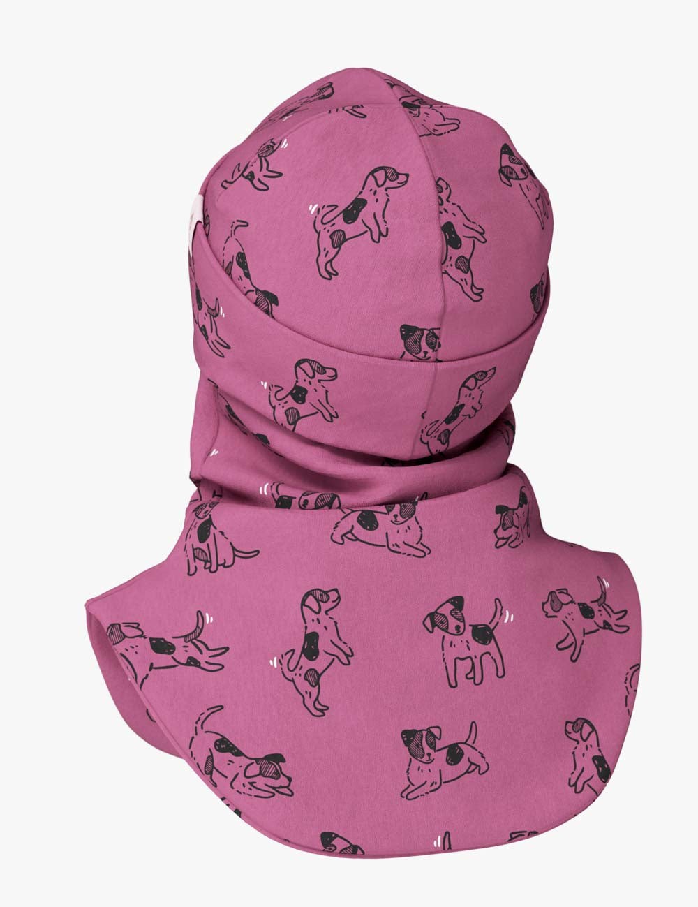 a child in a soft pink dogs balaclava, cozy and content in gentle morning light