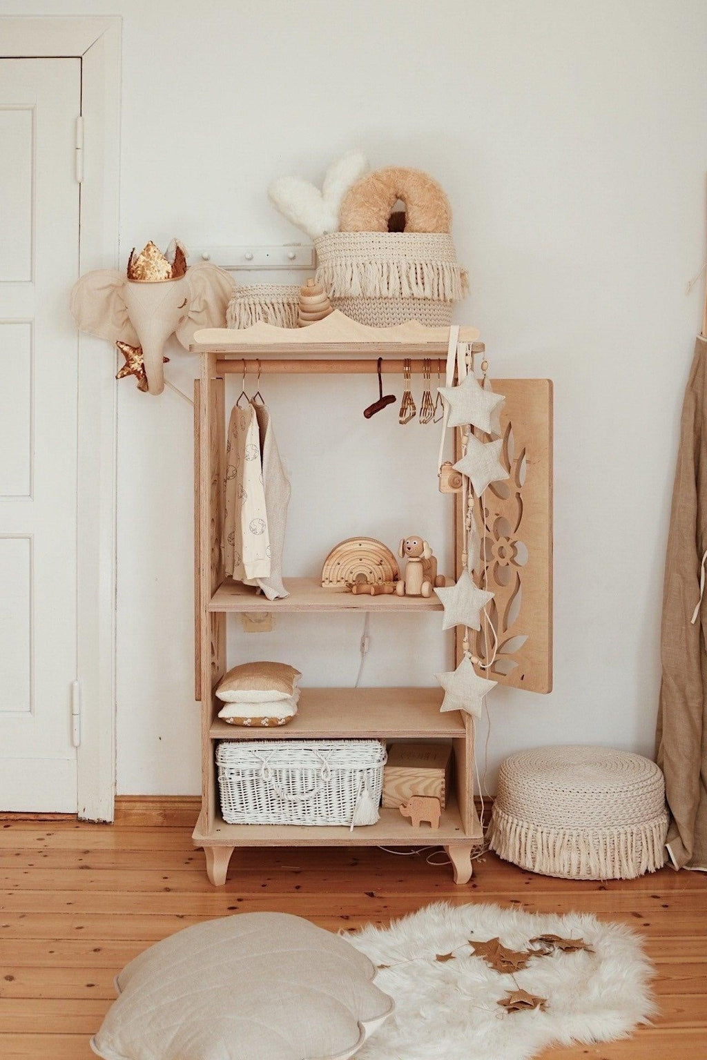 practical setup of a 3m sand star dust garland hung over a wooden crib