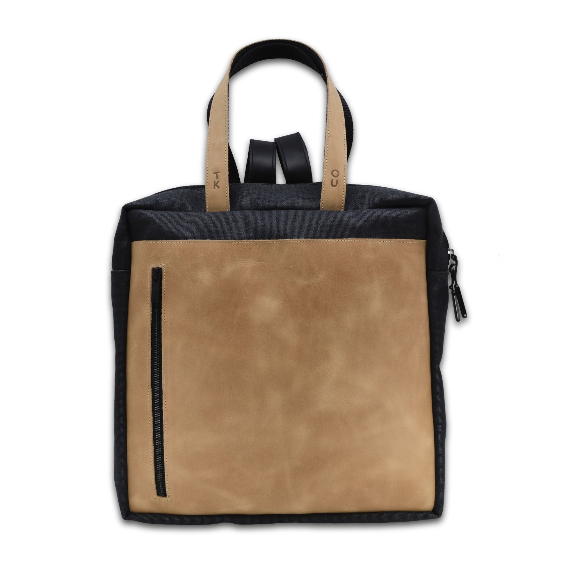 bold beige stockholm backpack with leather details in dramatic studio lighting