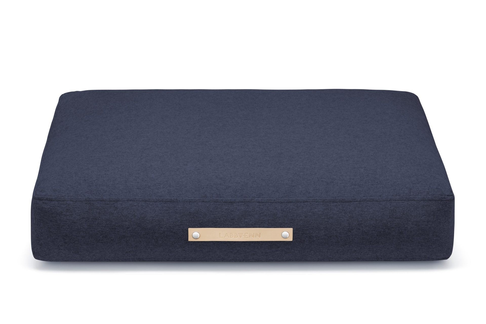 bold navy scandinavian dog cushion with a sleek leather belt and modern texture