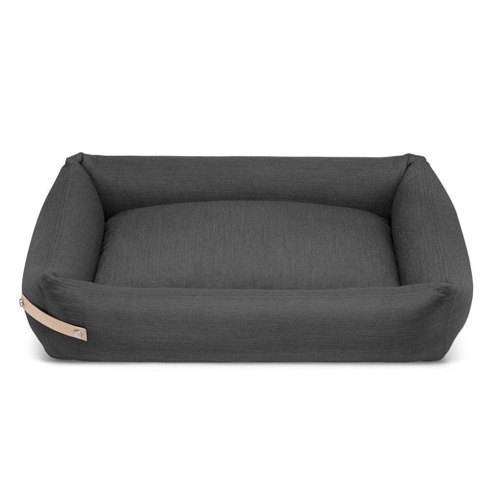 soft grey stokke dog bed with a cozy cotton inlett in a sunlit corner