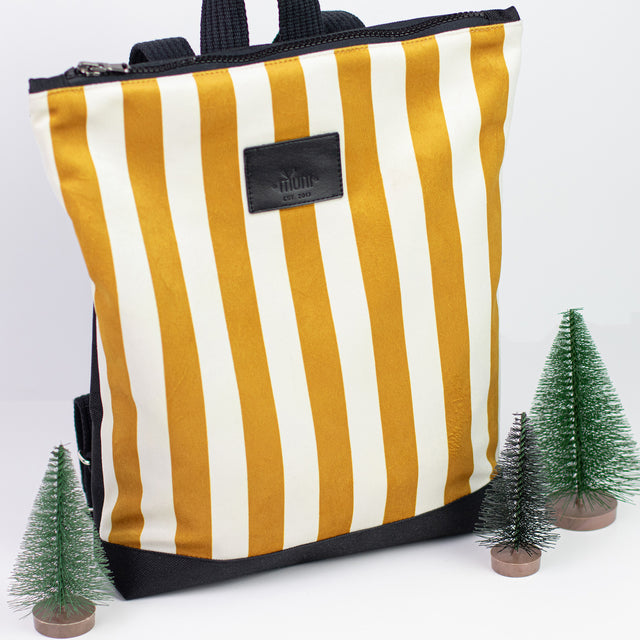 Striped Mustard Backpack for Kids – Stylish & Durable Outdoor Gear by Muni at www.brixbailey.com