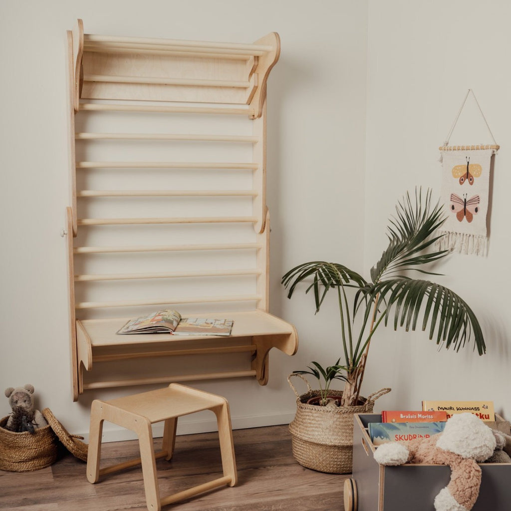 a child's birch plywood climbing table and chair set in a softly lit nursery