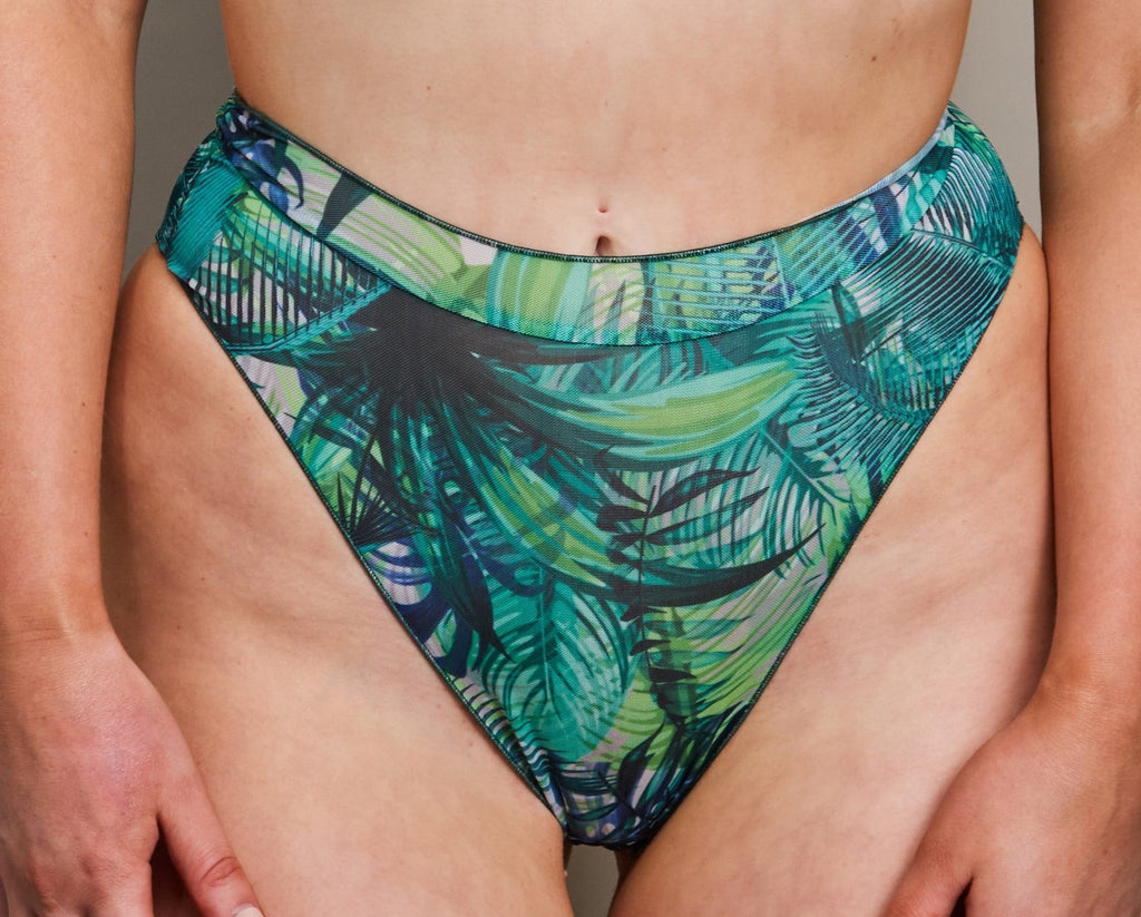 soft tropical palm green bikini set with a gentle, comforting fit on a serene beach