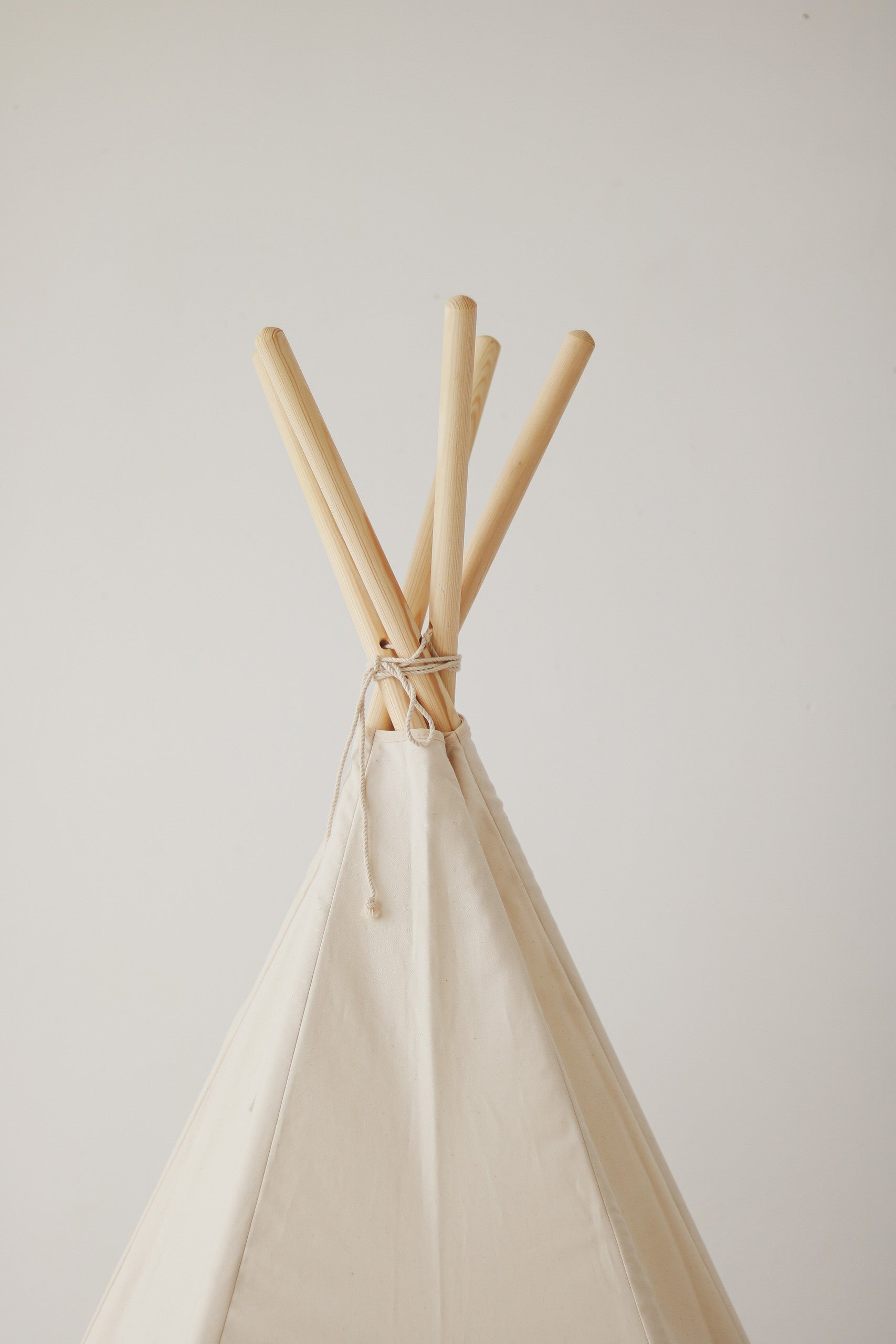 a functional kids cotton teepee tent with sturdy pine poles and a storage cover