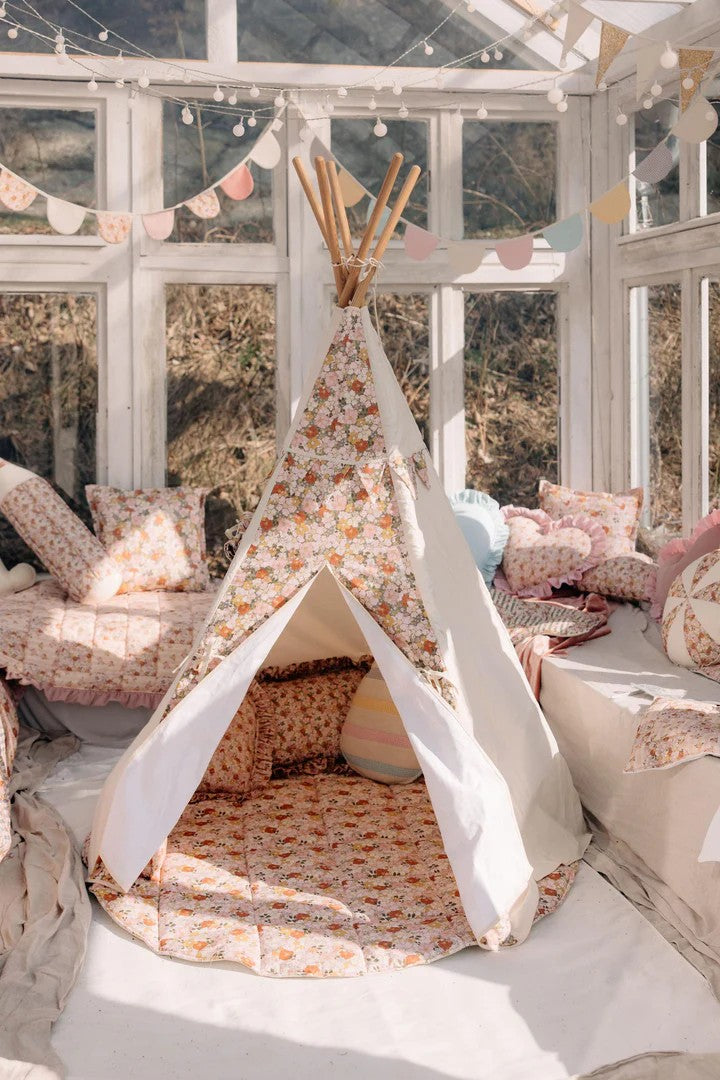 soft green garden teepee tent with floral print, cozy reading nook for kids in a sunlit playroom