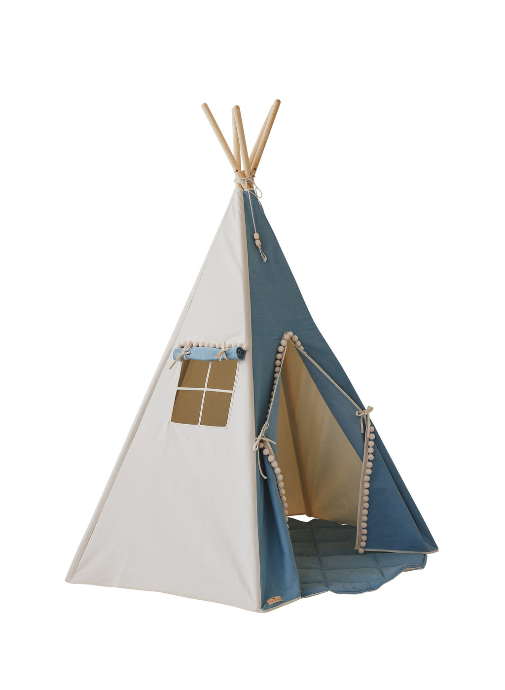 handmade cotton teepee tent with playful pompoms in a cozy indoor playroom setting