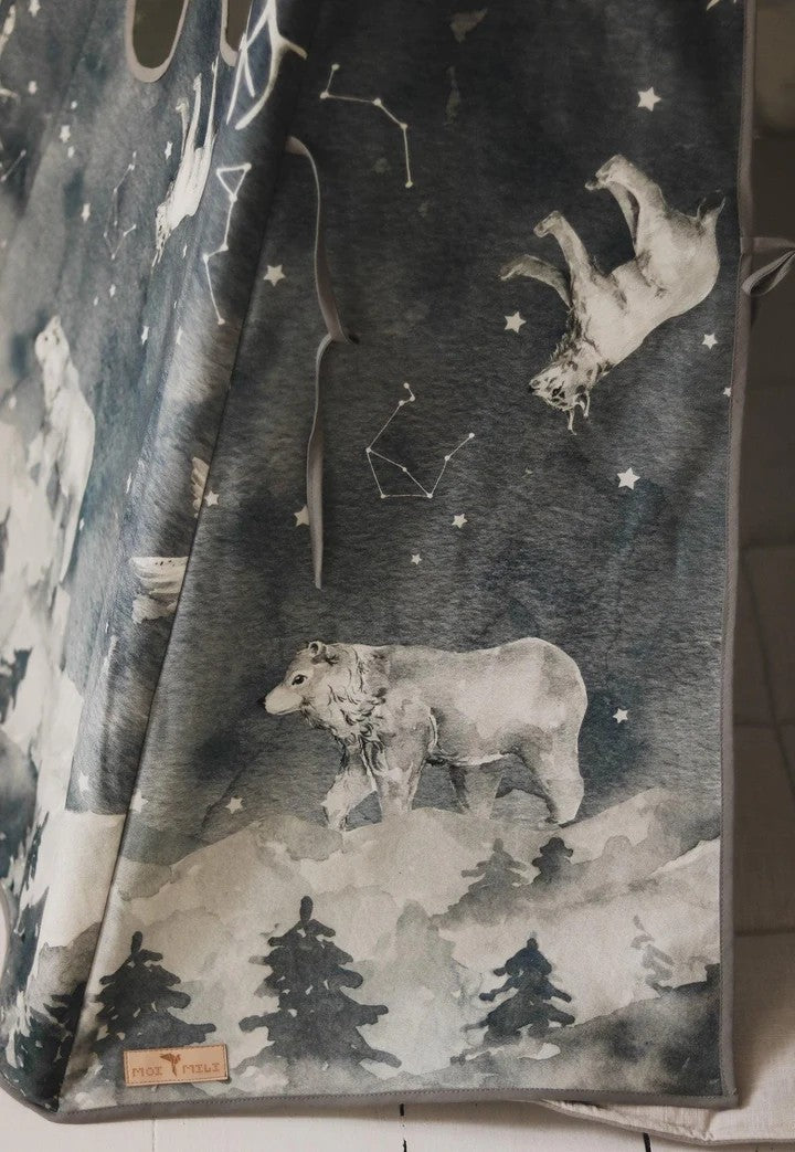 softly lit teepee tent with starry animal pattern, pine poles, and cozy cotton fabric for winter nights