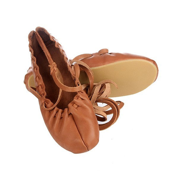 soft leather tied dancing shoes with adjustable laces, resting on a cozy textile bag, handmade in estonia