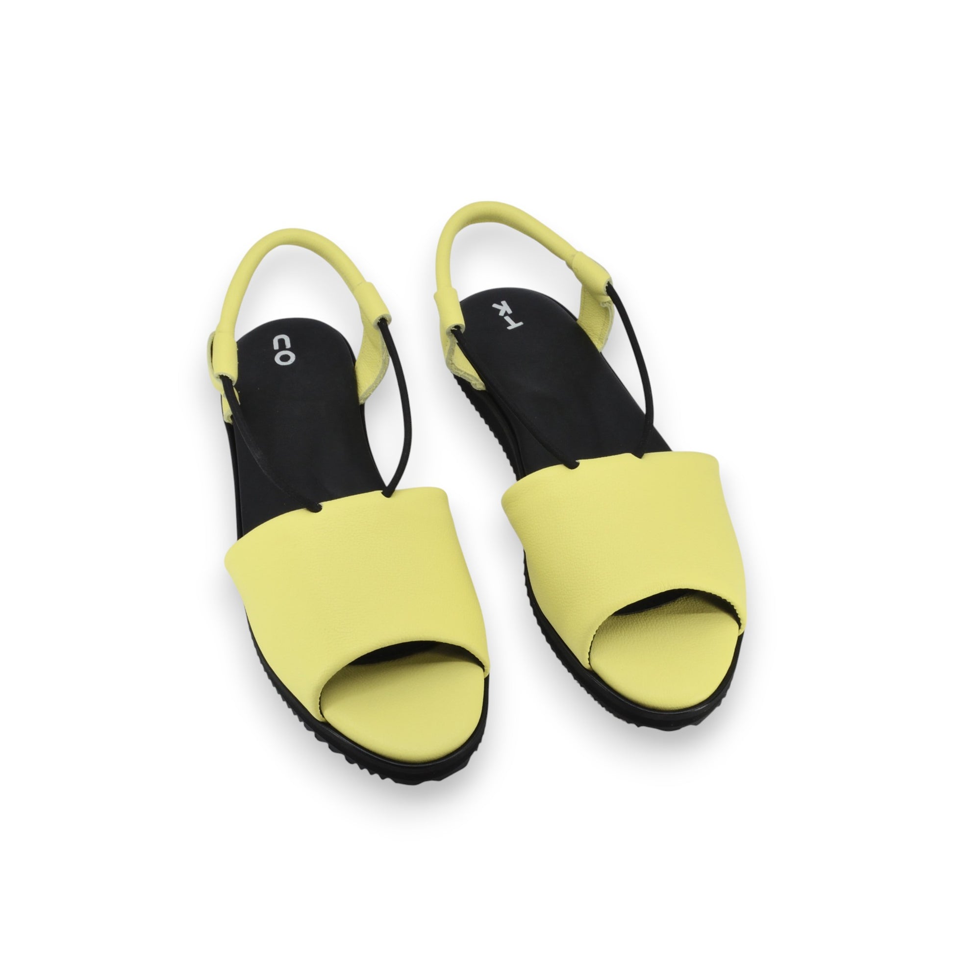 bold lime yellow leather berlin sandals with a confident close-up on the ergonomic insole