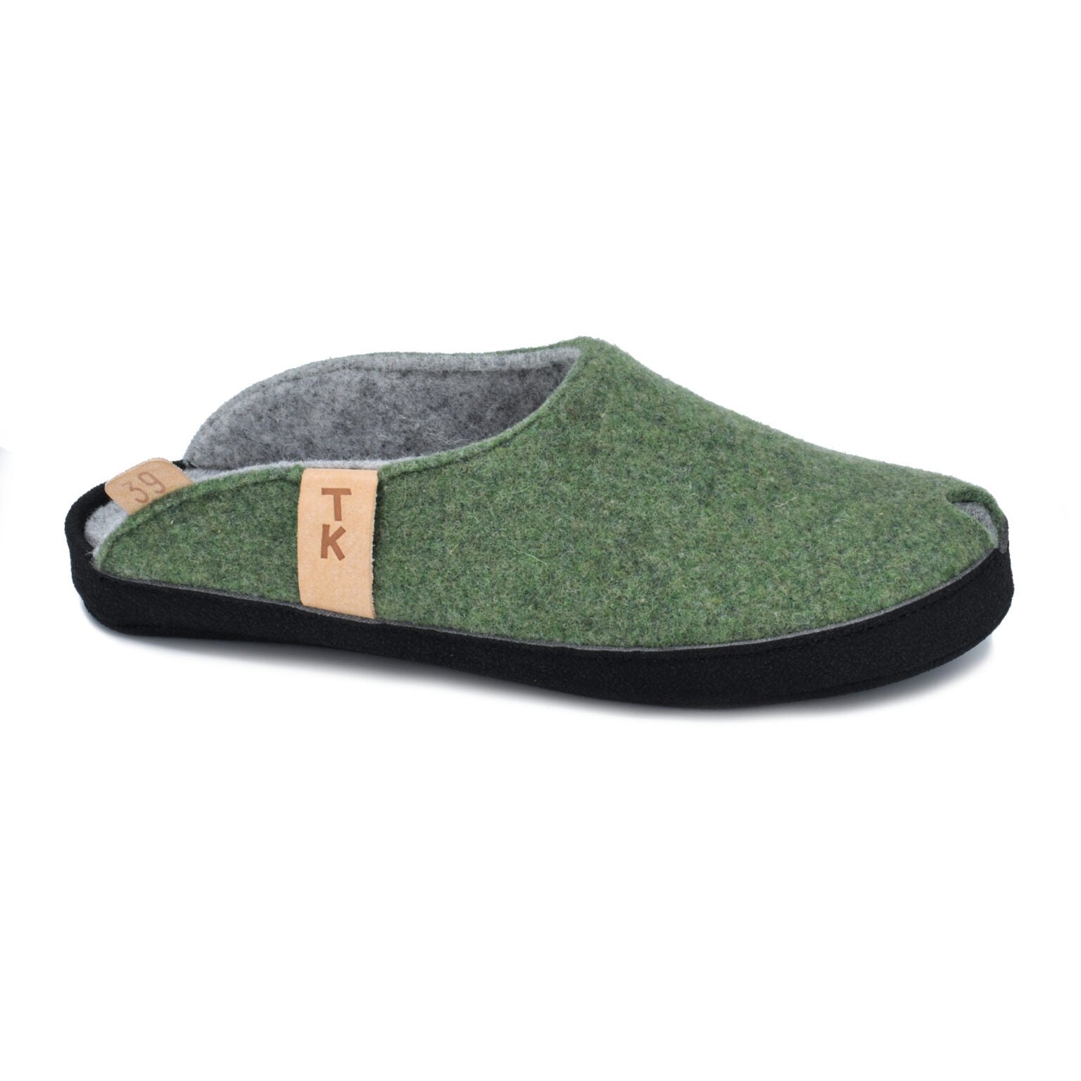 close-up of moss green toku brussels slippers showing the durable black microfibre sole and lambswool felt construction