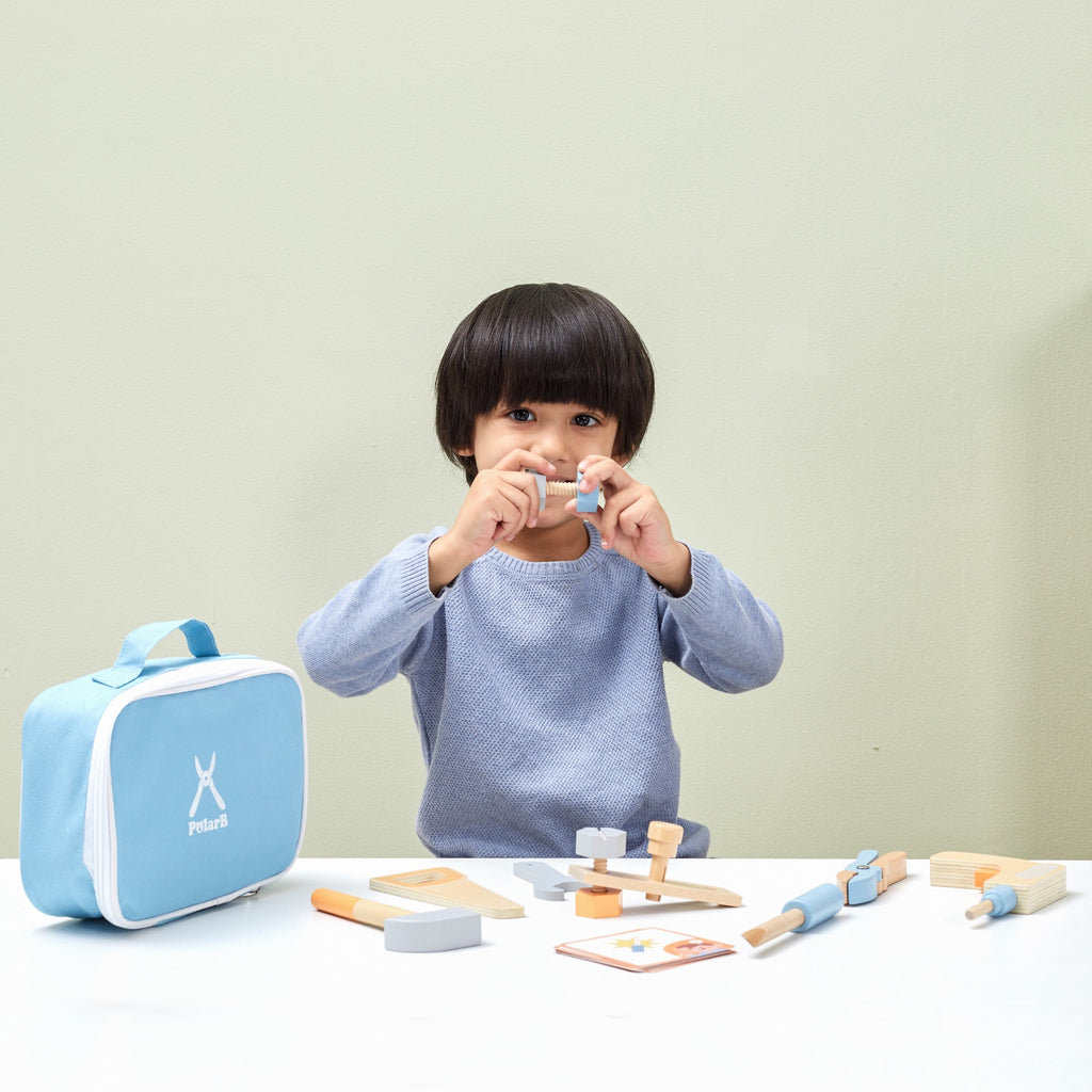 bold little handyman wooden tool bag with pastel tools, open to show hammer and screws