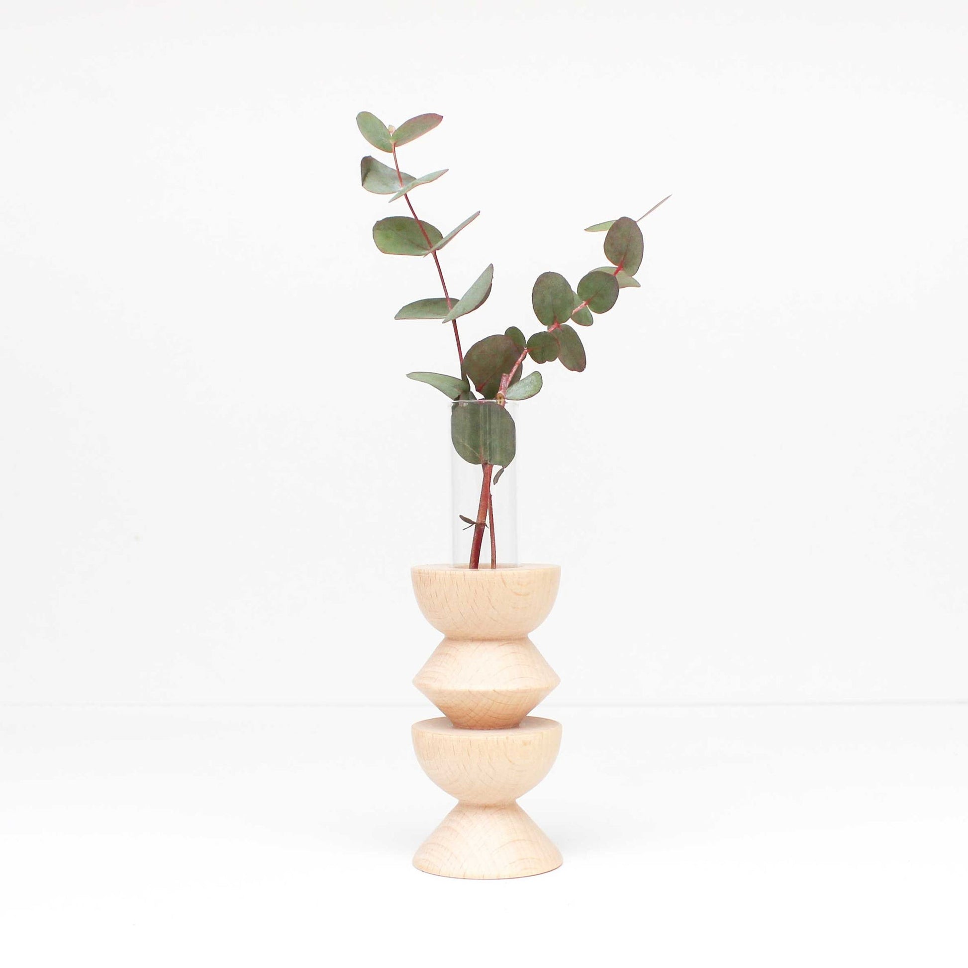 bold medium totem wooden vase on a dark background showcasing its solid beech wood base and sleek glass insert