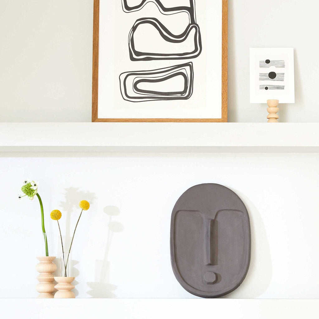 practical beech wood totem vase with removable glass tube on a clean kitchen counter