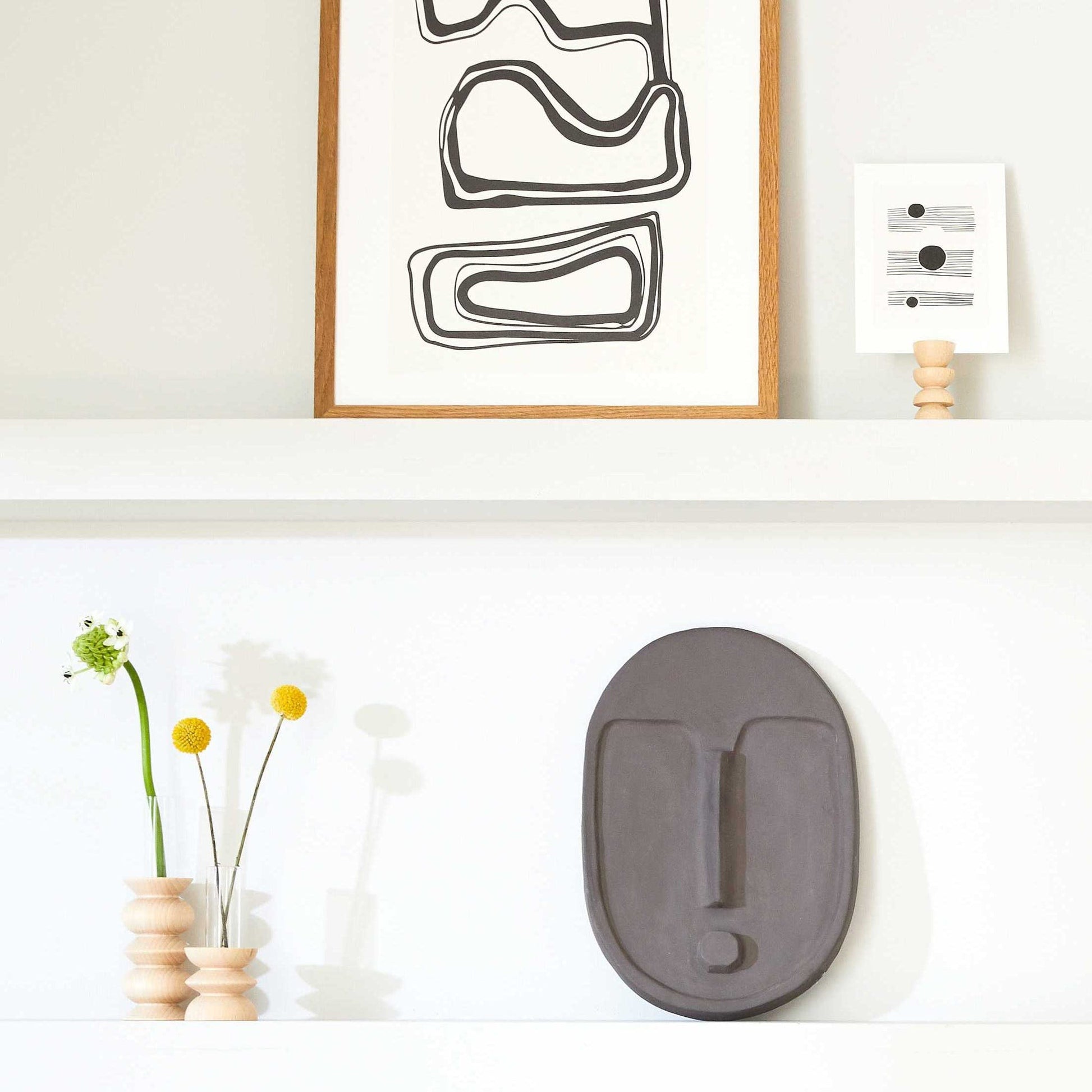 practical beech wood totem vase with removable glass tube on a clean kitchen counter