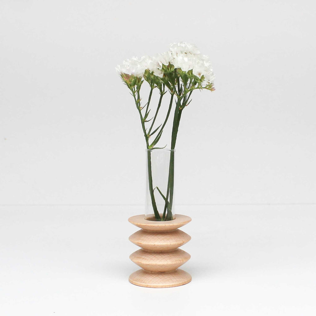 bold statement totem vase in solid beech wood with a sleek glass center