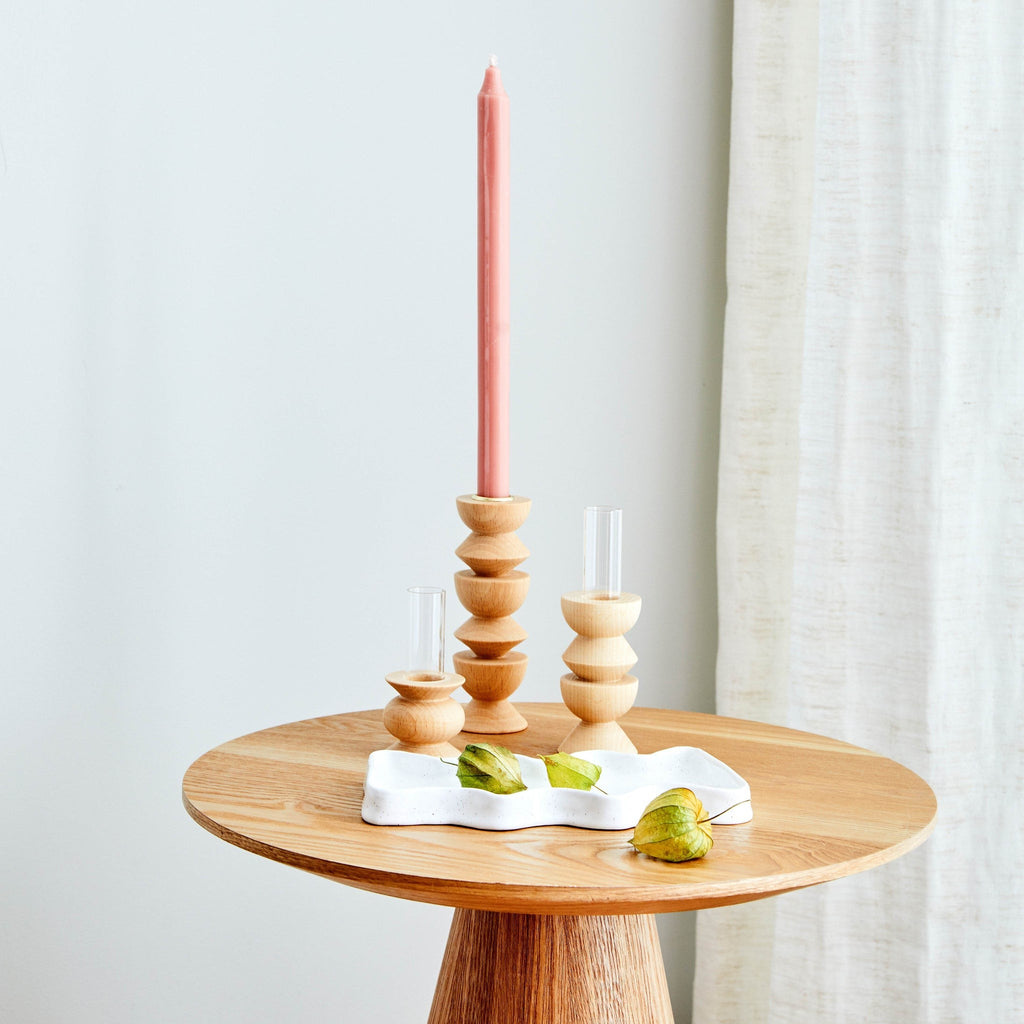 elegant short totem wooden vase with glass tube on a minimalist table, showcasing artisan beech wood craftsmanship