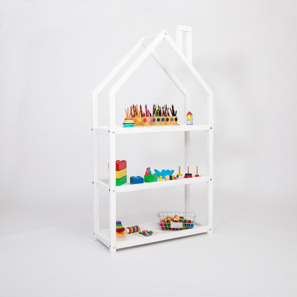 white house-shaped kids shelf with toys and books in a sunny montessori bedroom