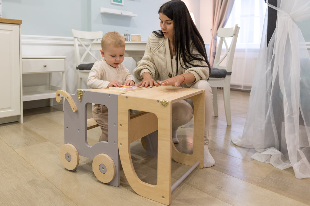 a refined golden yellow montessori table and chair set for children in a softly lit room