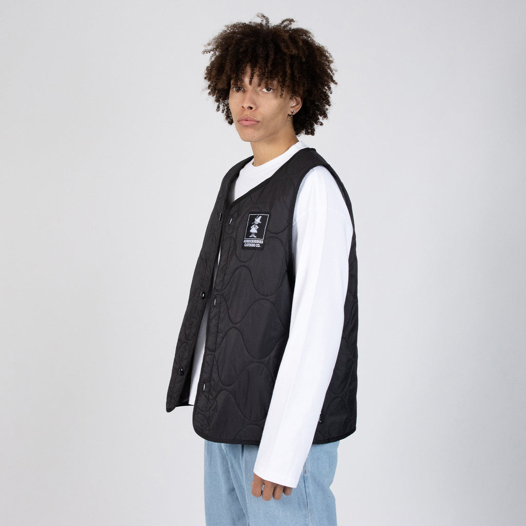 snufkin fishing vest in soft morning light, a comforting black nylon layer for quiet outdoor moments