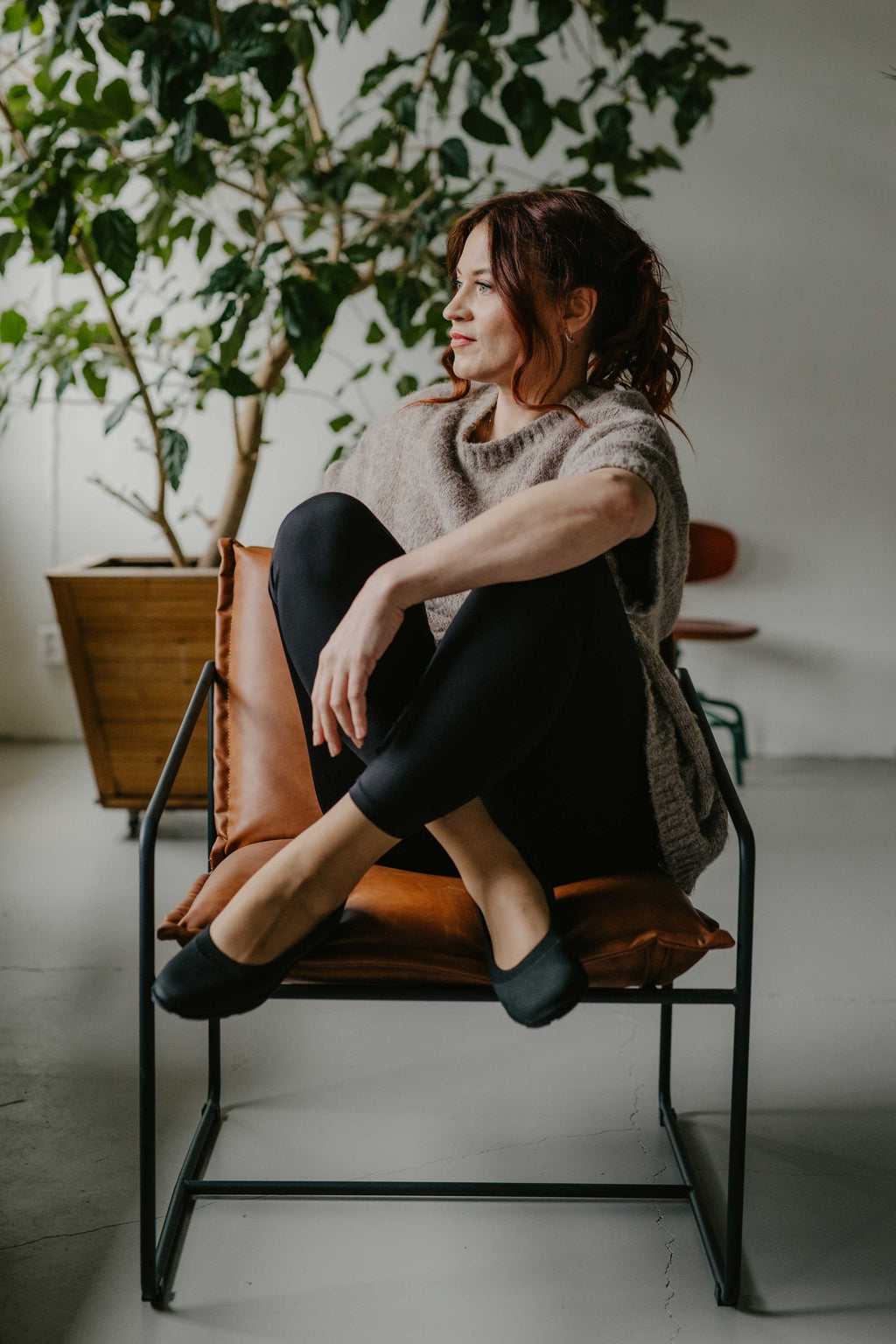 upcycled ballerina shoes with recycled tyre soles and soft tencel lining, shown in warm sunlight on wooden deck
