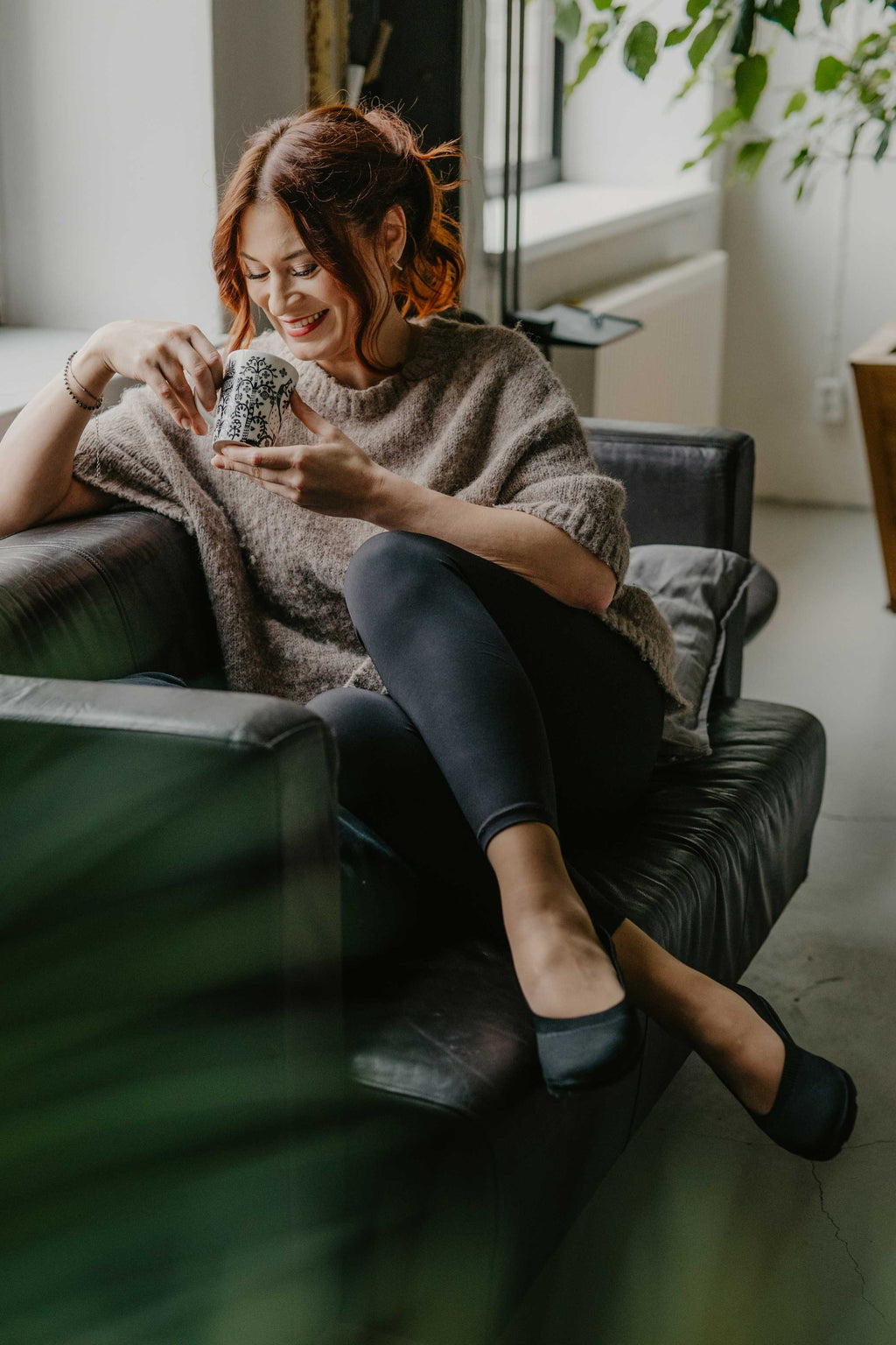 close-up of upcycled ballerina shoes with recycled tyre soles, soft tencel lining, and stretchy knit upper in natural light