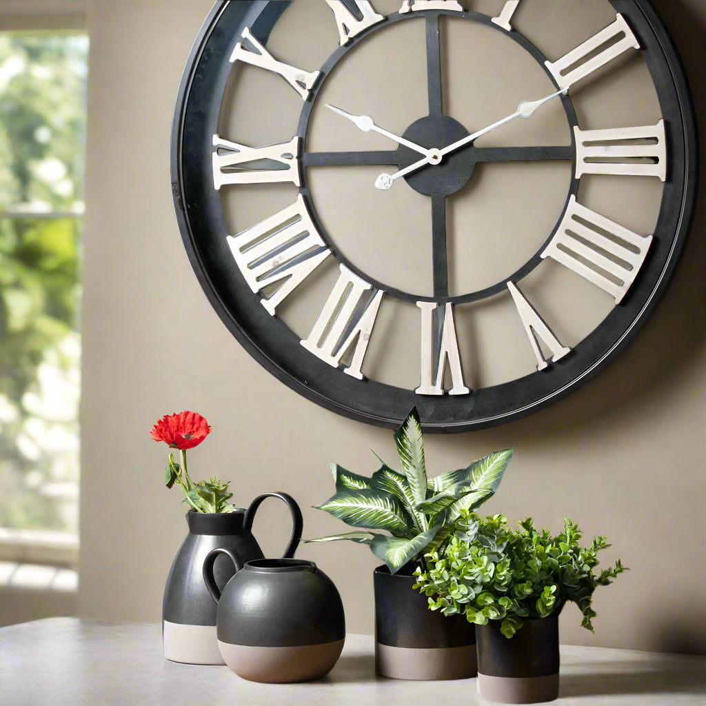 Black Skeleton Wall Clock with White Roman Numerals