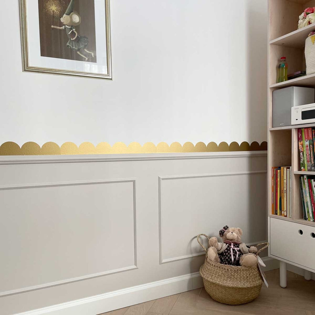 bold golden semicircle wall decals arranged in a striking modern pattern against a dark wall