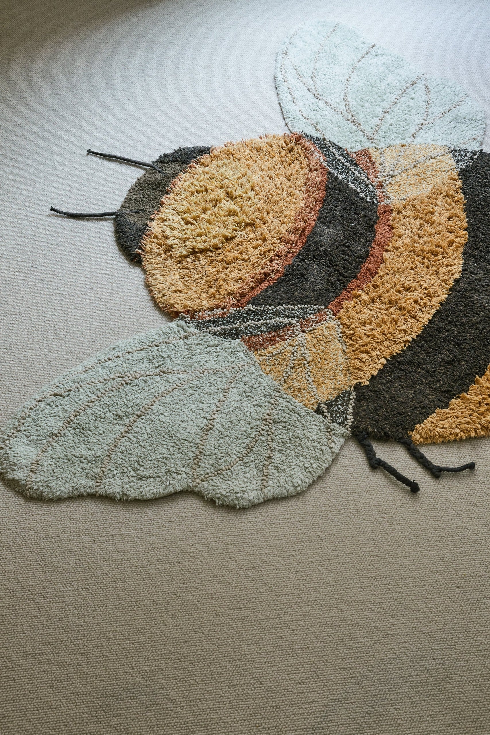 Transform Your Child's Room with a Fun and Educational Bee-Shaped Rug - Eco-Friendly & Handcrafted by Lorena Canals at www.brixbailey.com