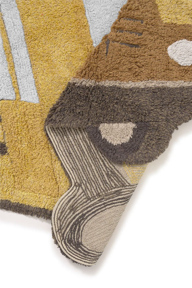 a close-up detail shot of the school bus rug's soft cotton texture and embroidered accents
