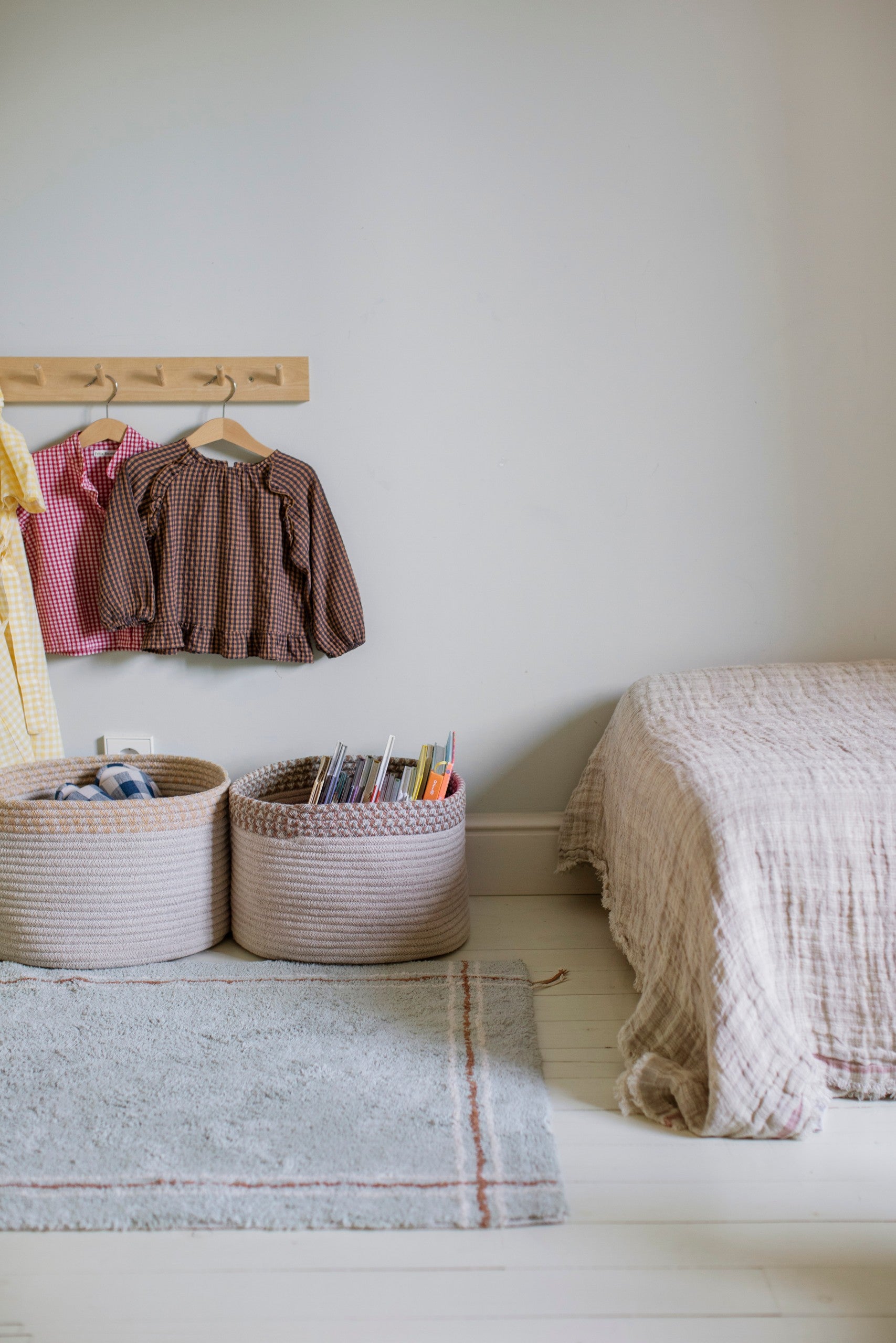 Inspired by traditional striped tea towels, this rug is handcrafted using RugCycled®’s signature canvas blend, a tufted soft cotton—in Blue Sage or Natural—with a decorative stripe around the edges, reminiscent of a tea towel print in Vintage Blue and Toffee. The raised edges are braided. by Lorena Canals at www.brixbailey.com