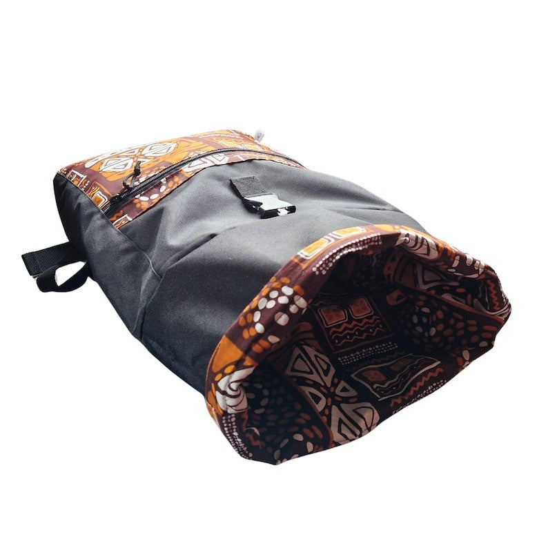 playful orange patterned waterproof backpack open on a sunny trail
