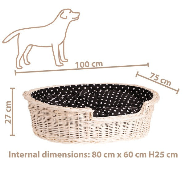 a playful golden retriever puppy peeking over the edge of a stylish whitewashed wicker dog bed