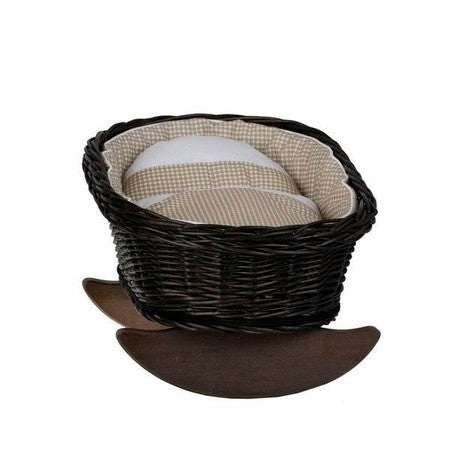 a functional wicker doll cradle with beige checkered bedding, shown from a practical side angle