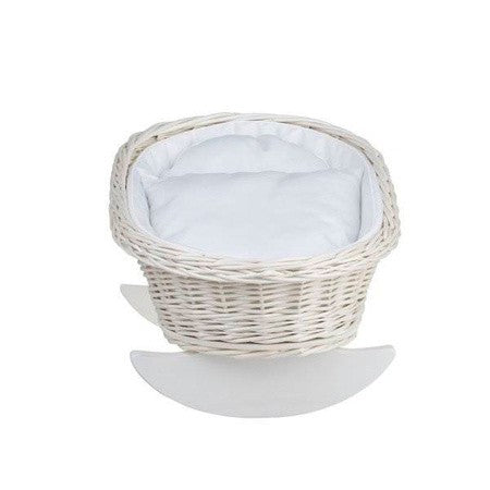 a functional wicker doll cradle with white bedding, perfect for nurturing play indoors