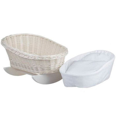 a functional wicker doll cradle with white bedding, viewed from a practical angle to show its spacious interior