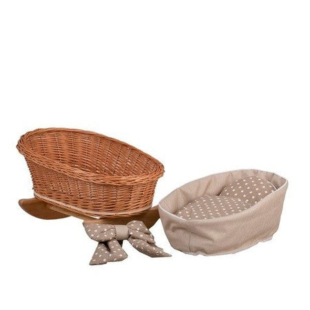 a soft beige checkered blanket in a natural wicker doll cradle, perfect for nurturing play