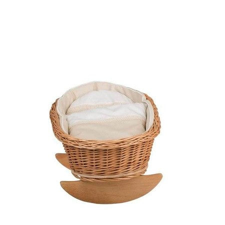elegant wicker doll cradle with soft white bedding in a refined nursery setting
