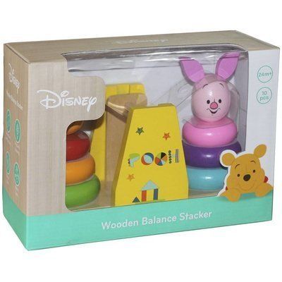 confident child stacking winnie the pooh and piglet wooden blocks in a sunlit playroom
