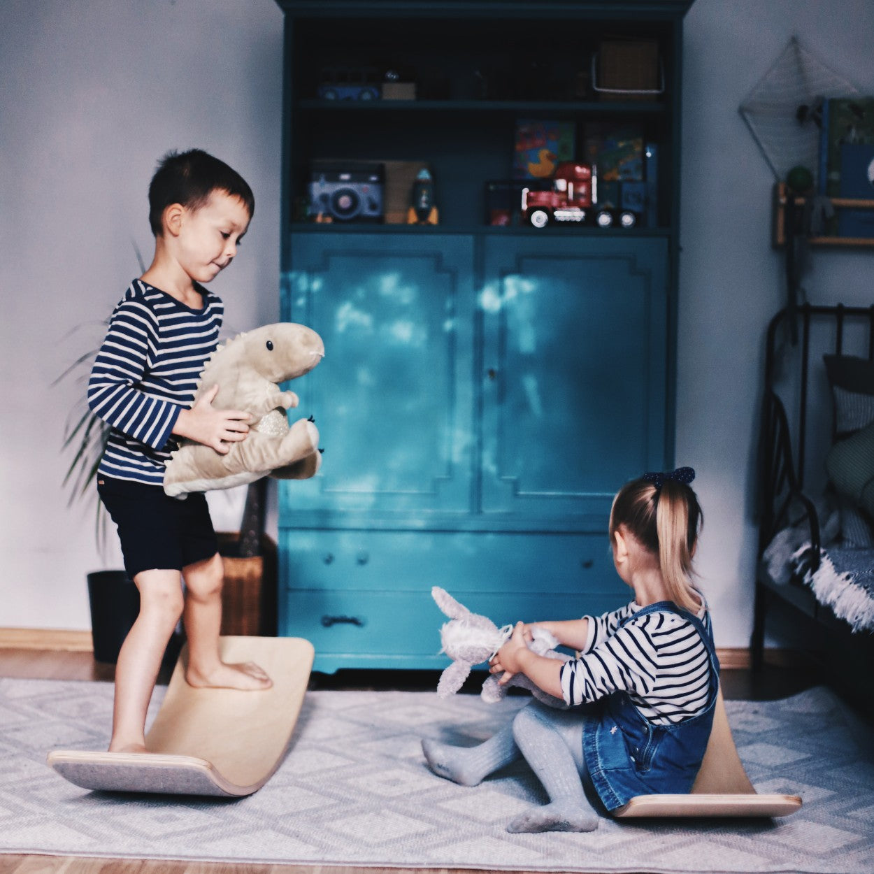 a bold, low-angle shot of a wooden balance board with grey felt, showcasing its powerful curve and minimalist design