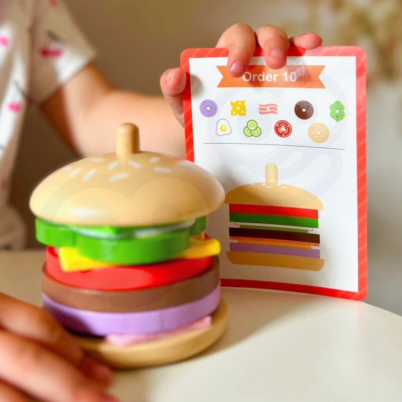 elegant wooden burger puzzle with stacked ingredients on a recipe card