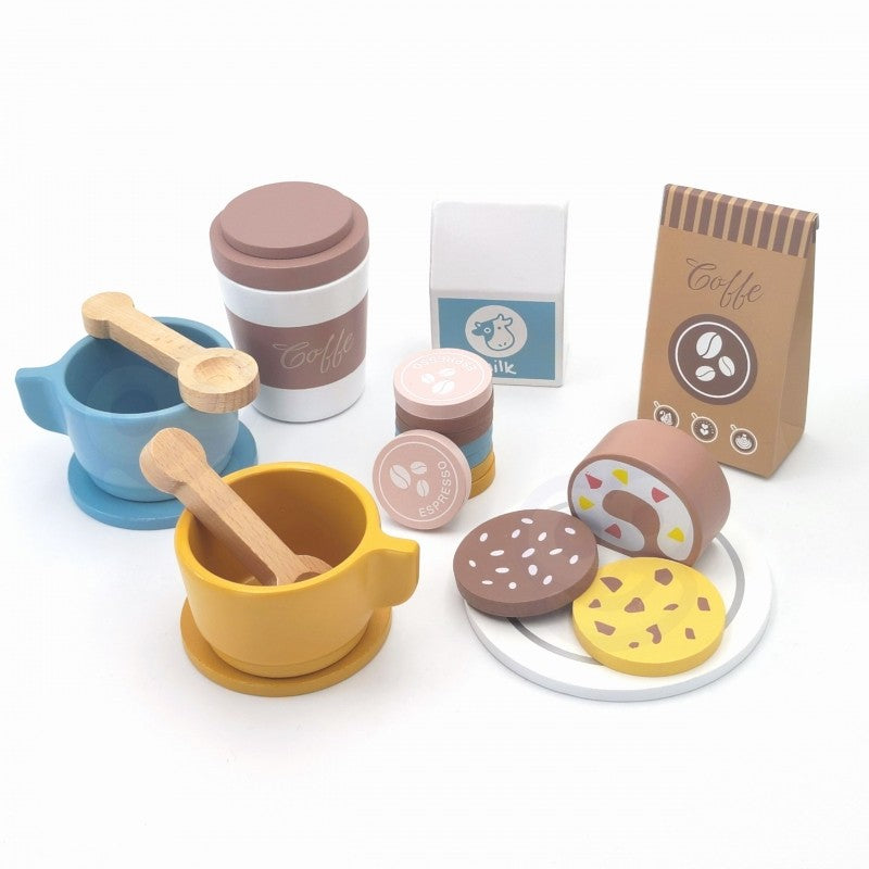 close-up of a child's hands playfully arranging wooden coffee cups and pastries from the woopie green playset