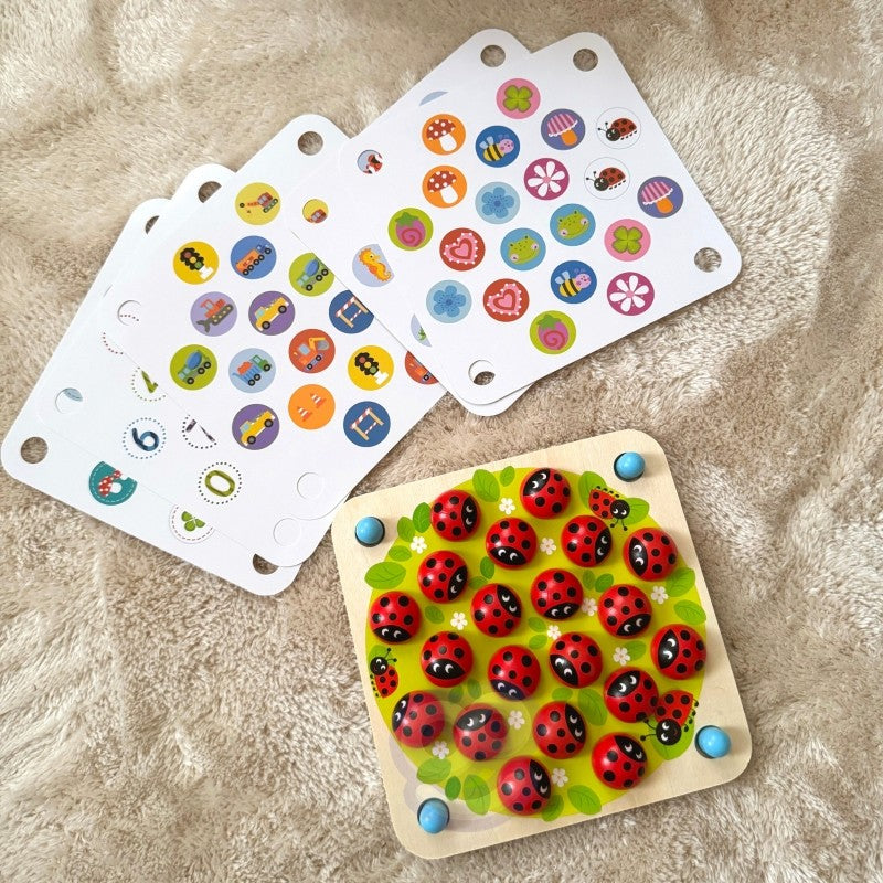close-up of a functional wooden memory puzzle with ladybug cards laid out for a counting game