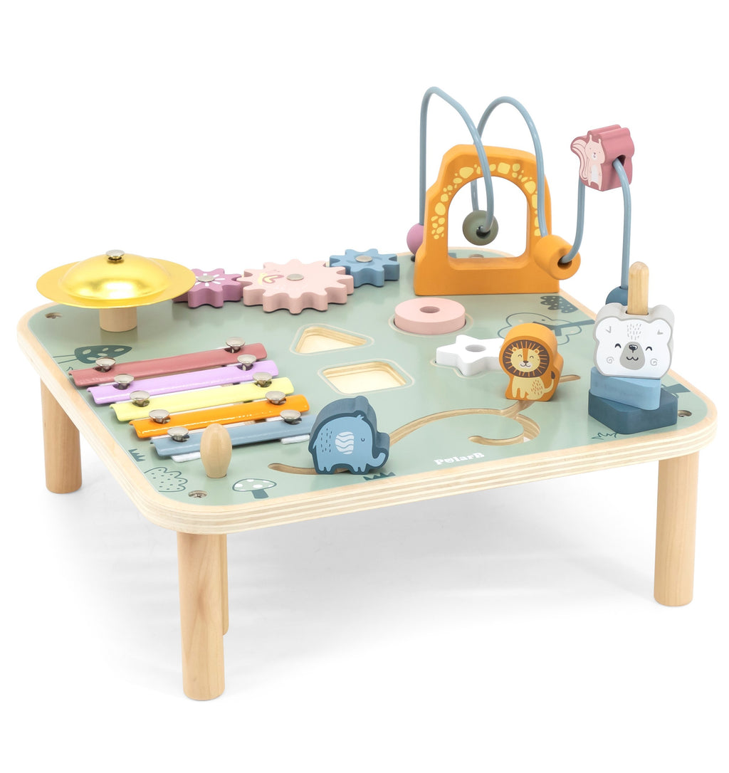 close-up of a wooden sensory table with pastel gears and a xylophone, bathed in warm sunlight