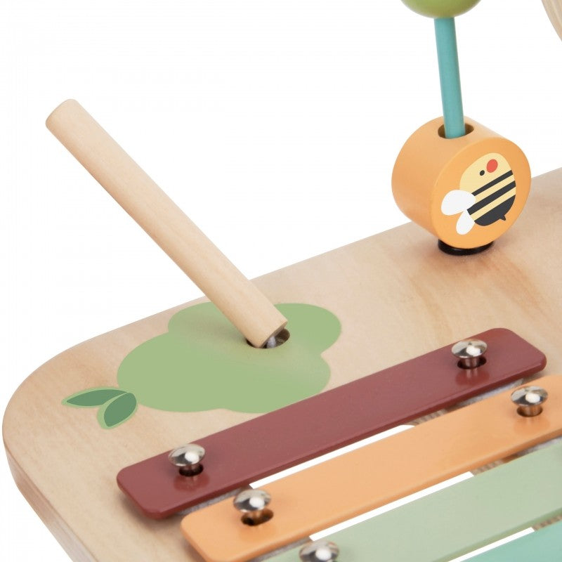 a soft-focus close-up of the woopie green activity table's bead maze and smooth wooden gears
