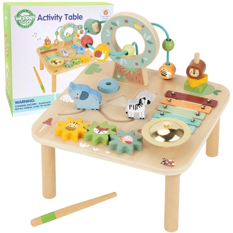 a toddler's hands sorting colorful shapes on the woopie green wooden activity table