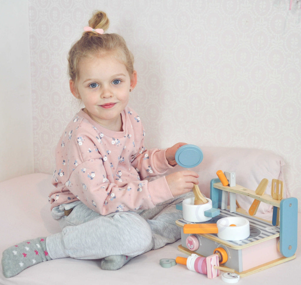 soft pastel wooden folding stove and grill with colorful play food and utensils for imaginative toddlers